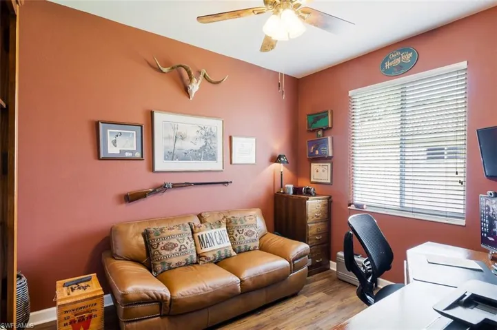 Office space featuring ceiling fan and hardwood / wood-style floors