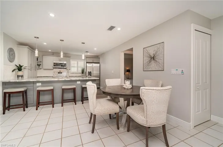 Dining room  with bar seating at the counter