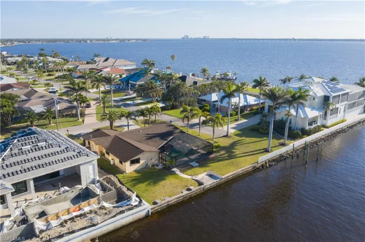 Aerial view with a water view and a residential view