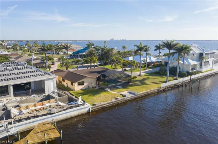 Aerial view featuring a residential view and a water view