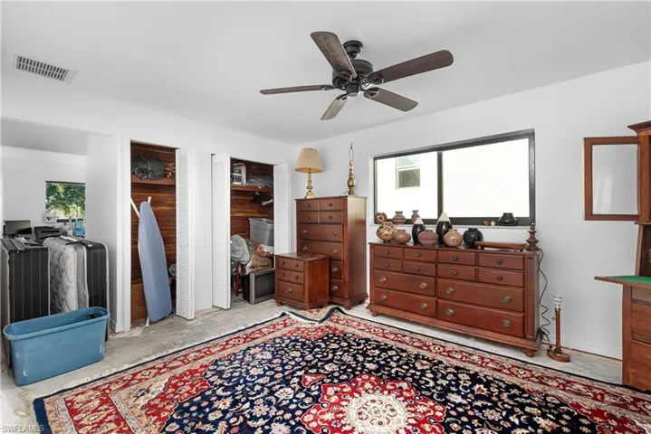 Bedroom featuring ceiling fan and visible vents