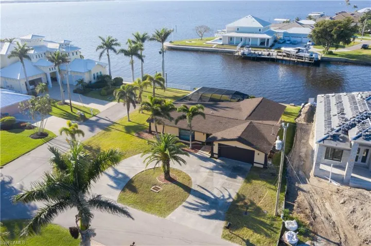 Birds eye view of property featuring a residential view and a water view