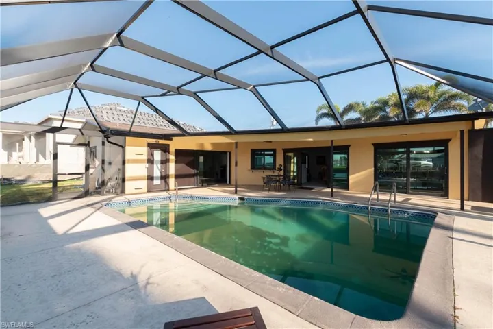 Pool featuring a lanai and a patio area