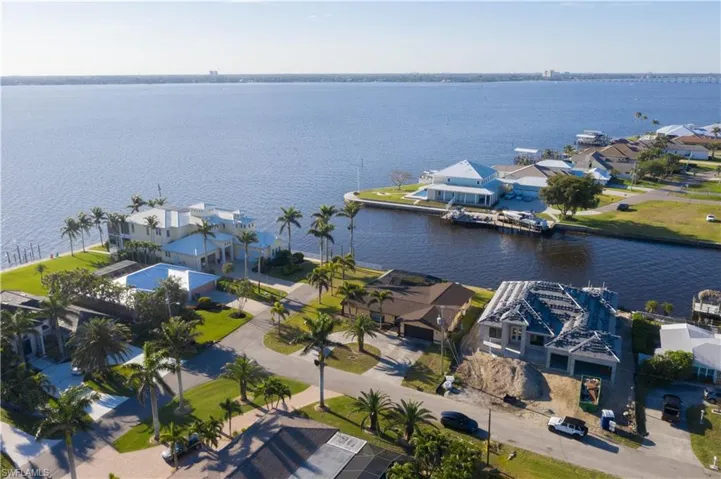 Drone / aerial view with a residential view and a water view