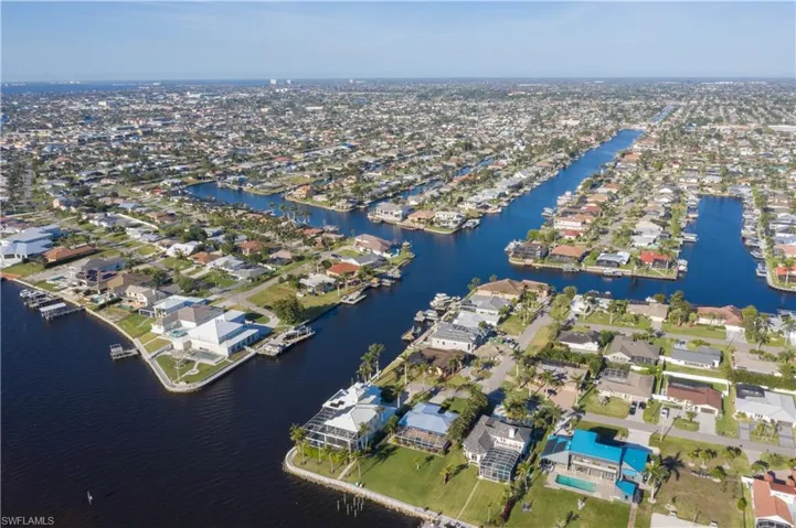 Birds eye view of property featuring a residential view and a water view