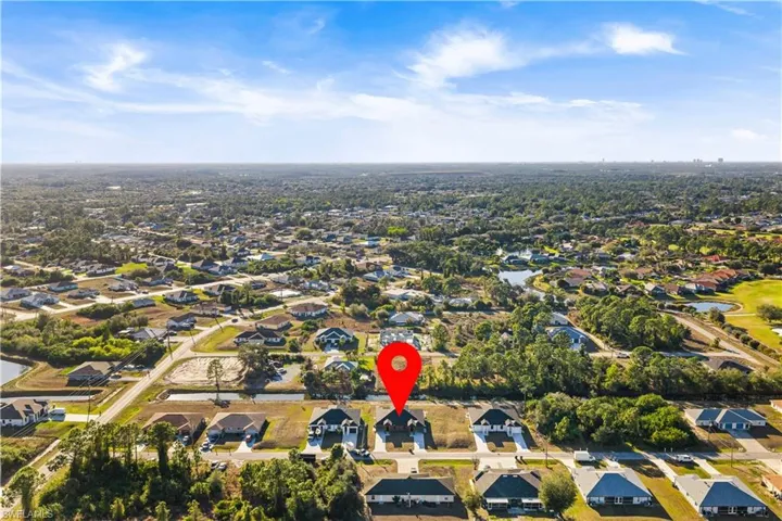 Aerial view of residential area with a large body of water