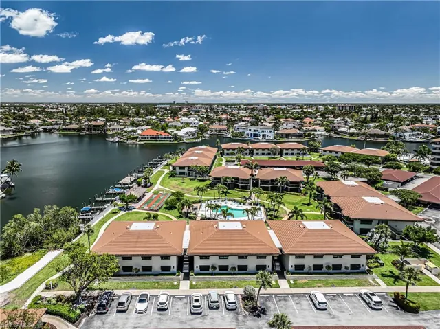 Aerial perspective of suburban area with a nearby body of water