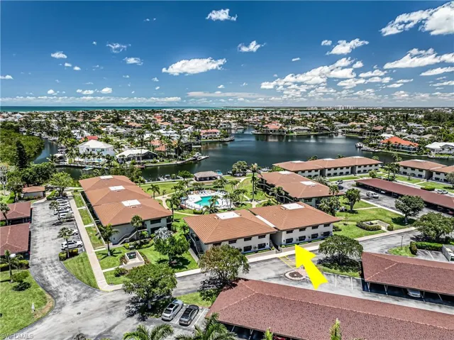 Aerial perspective of suburban area with a large body of water