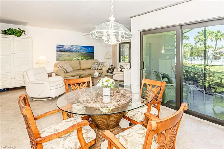 Dining space with a chandelier and light tile patterned floors