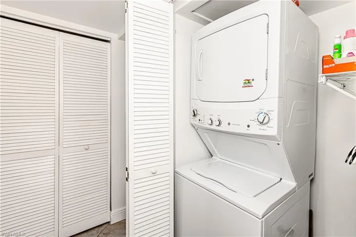 Laundry area featuring stacked washer / dryer