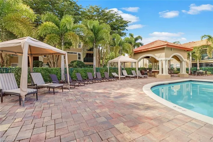 View of swimming pool with a gazebo and a patio area