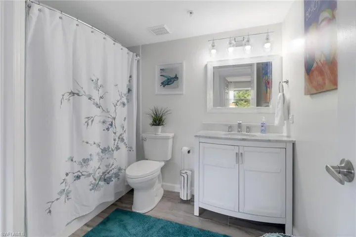 Bathroom with walk in shower and vanity