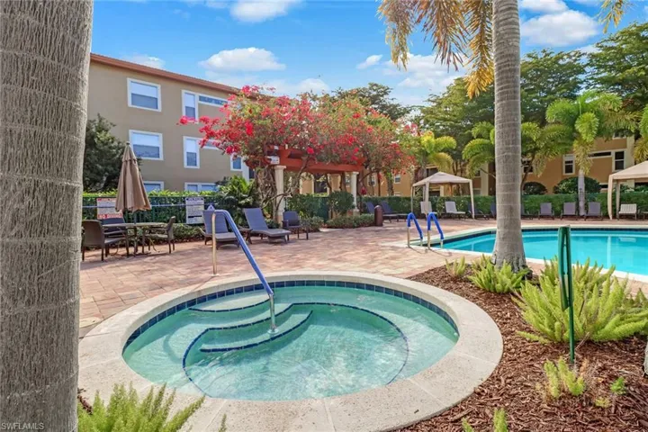 View of spa featuring a gazebo, a hot tub, and a patio