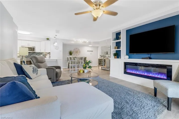 Living room  built in shelves and ceiling fan