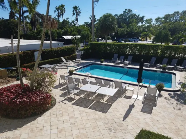courtyard swimming pool, grill , hammock,chairs umbrellas