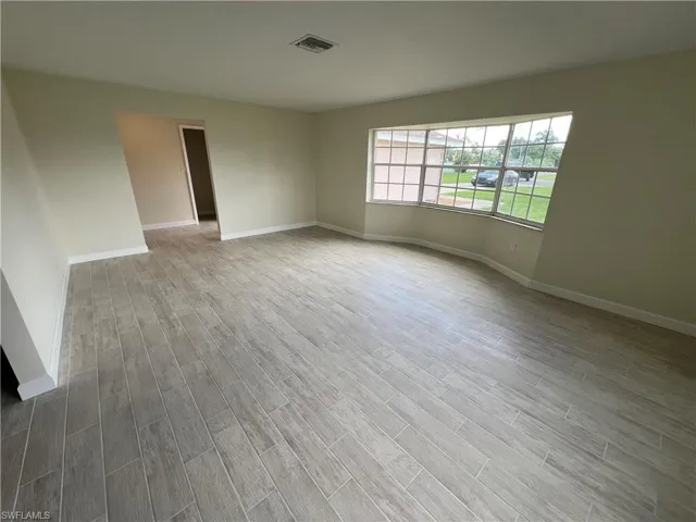 Spare room with light hardwood / wood-style floors