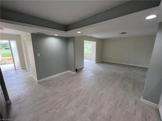 Unfurnished room with light hardwood / wood-style floors