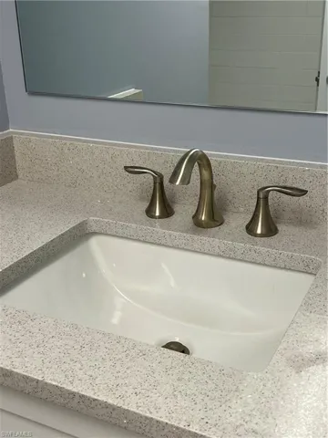 Room details with backsplash and vanity