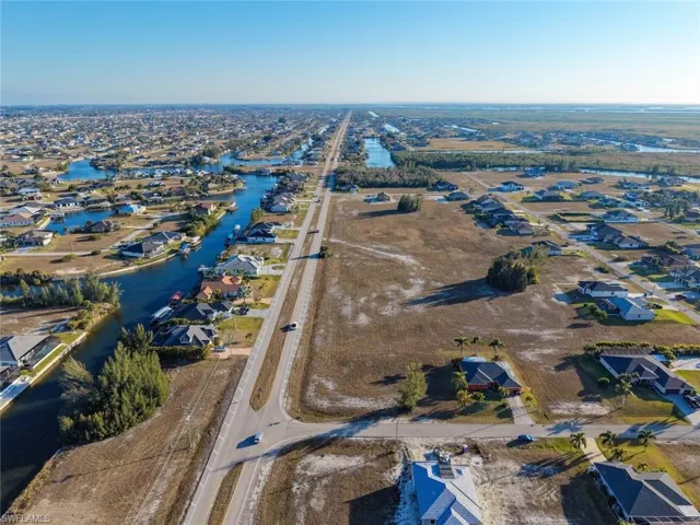 View of property location featuring nearby suburban area and a large body of water