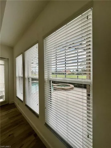 Detailed view of baseboards and wood finished floors