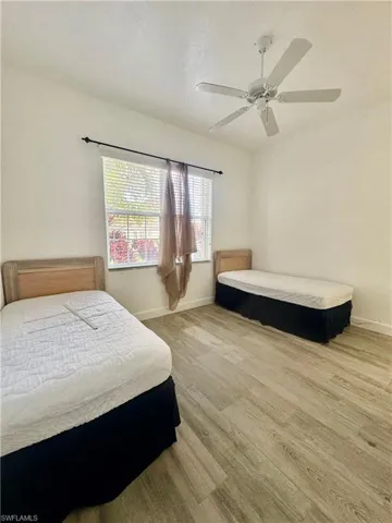 Bedroom featuring a ceiling fan and light wood-style floors