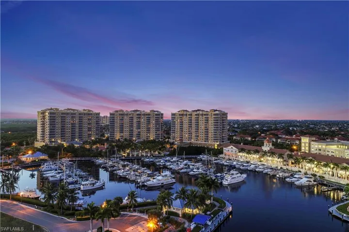 Aerial view at dusk of view of marina and a water view