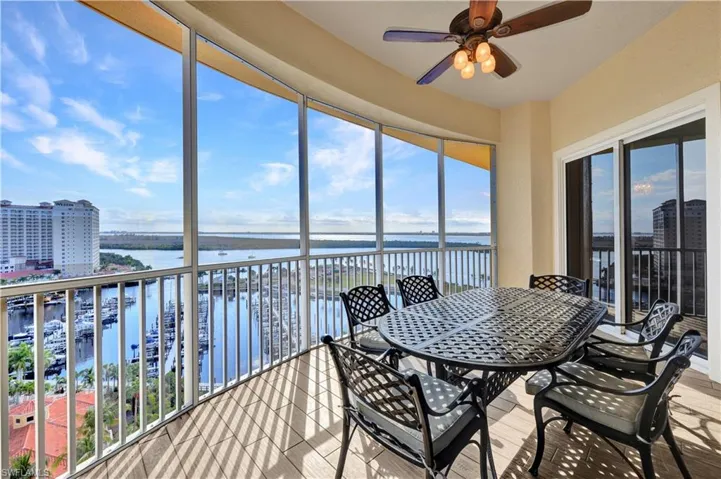 Sunroom featuring a water view