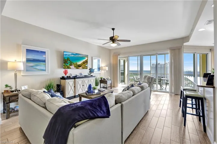 Living area with wood finish floors and a ceiling fan
