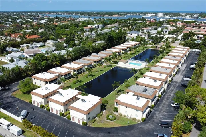 Aerial view of residential area with a nearby body of water