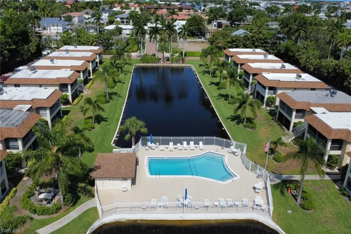 Aerial view of a nearby body of water and a pool area