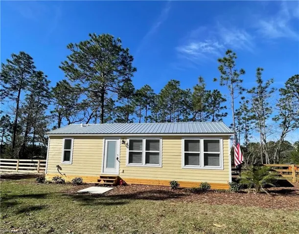 View of front of property with a front yard