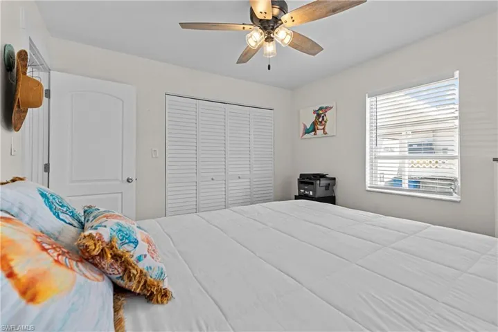 Bedroom featuring a closet and ceiling fan