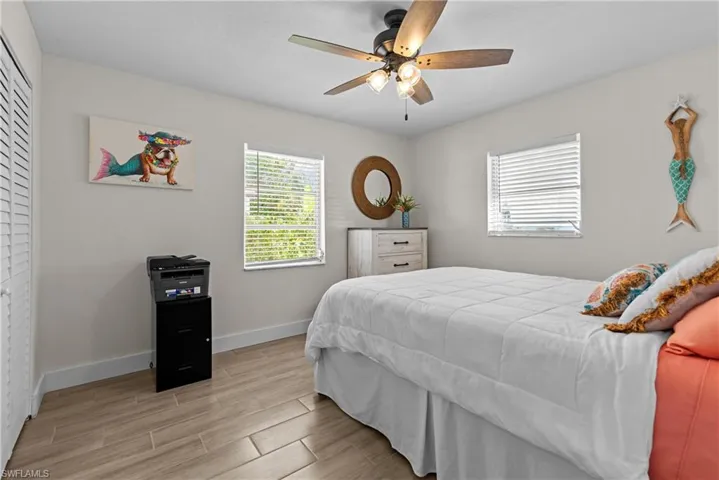 Bedroom featuring light hardwood / wood-style flooring and ceiling fan