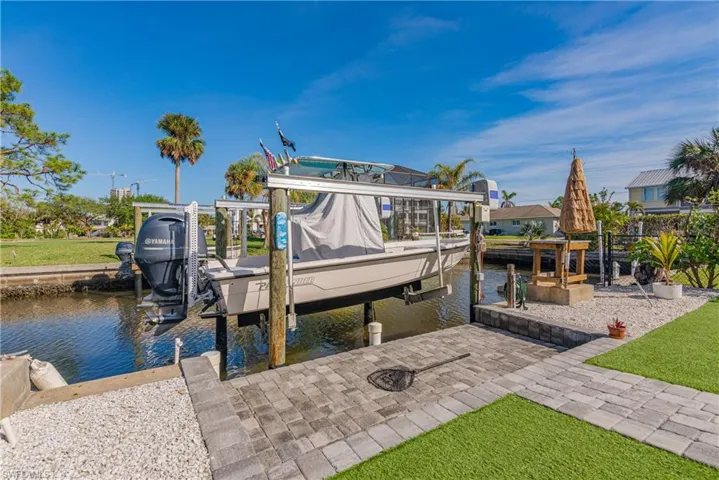 Dock area featuring a water view