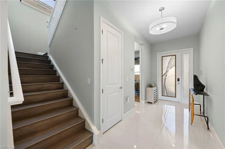Staircase to loft and two additional bedrooms and bathrooms