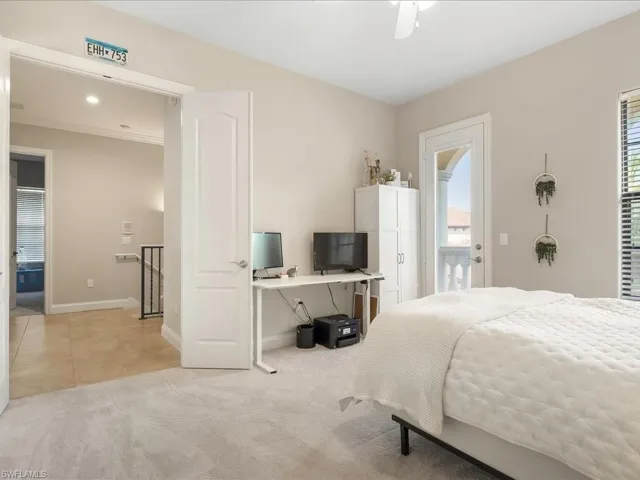 Bedroom featuring light carpet, light tile patterned flooring, access to outside, an office area, and recessed lighting