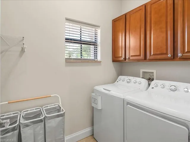 Washroom with independent washer and dryer and cabinet space