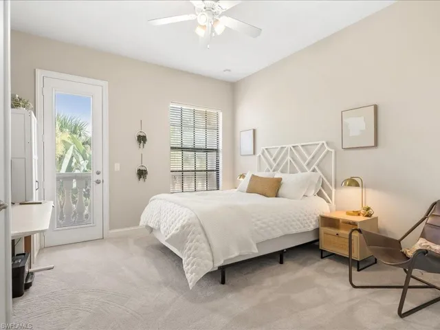 Bedroom featuring light carpet, access to outside, and a ceiling fan