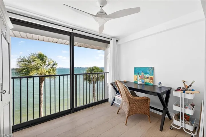 Light wood-finish flooring complements white walls