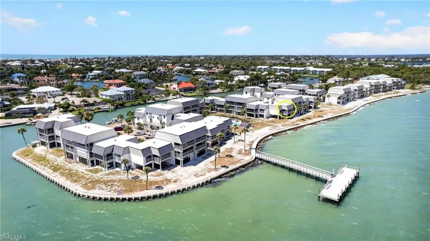 Waterfront condominium complex with a private pier