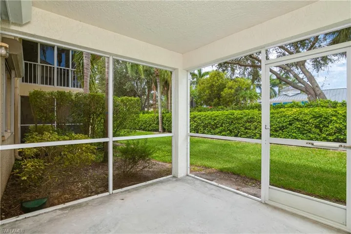 1st floor screed lanai with landscaped views.