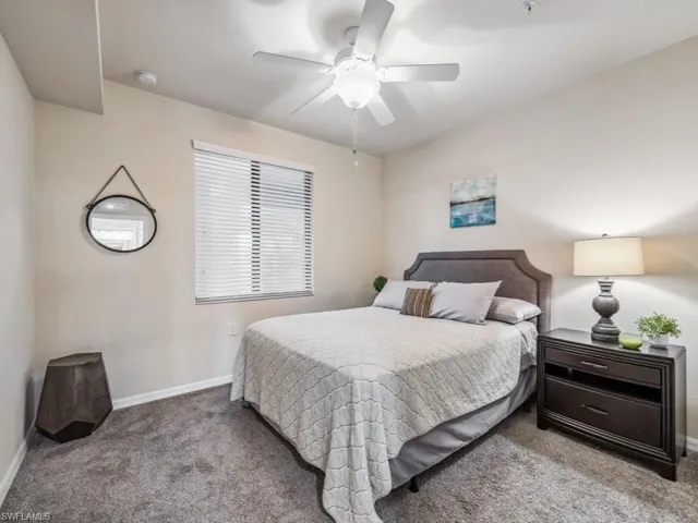 Newly carpeted guest bedroom with ceiling fan
