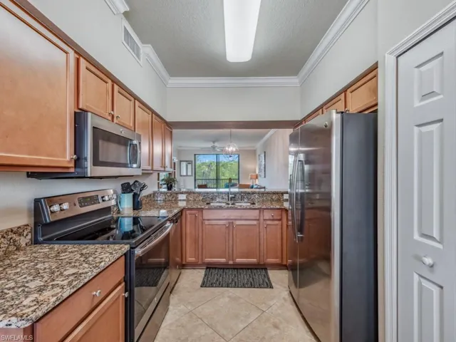Kitchen with stainless steel appliances and molding
