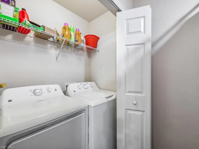 Laundry featuring washer and clothes dryer