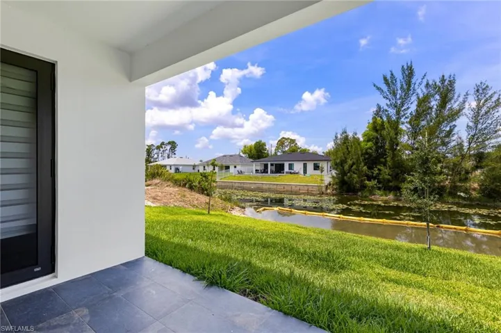 View of patio with a water view and a residential view