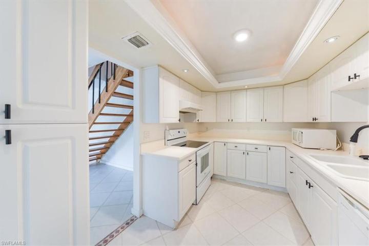 Kitchen with new stove and refrigerator