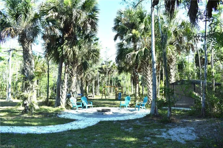 View of home's community featuring a fire pit