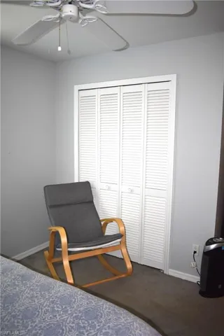 Bedroom featuring carpet flooring, a closet, and ceiling fan