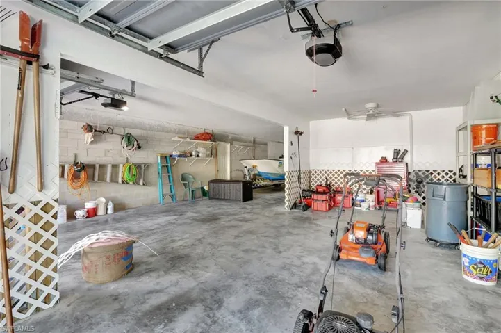Garage featuring a garage door opener