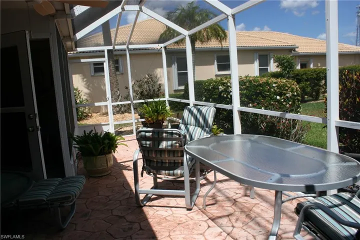 Sunroom / solarium featuring outdoor dining space
